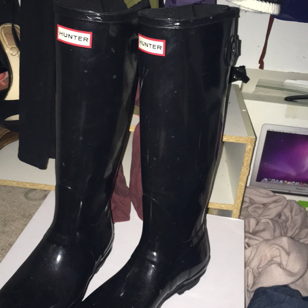 Black tall glossy hunter boots